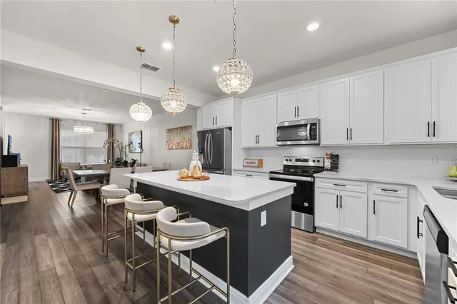 a view of a dining room with furniture and wooden floor