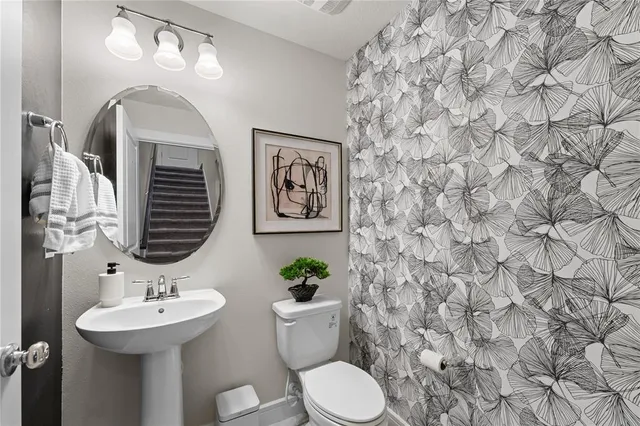 a view of entryway with wooden floor and a front door