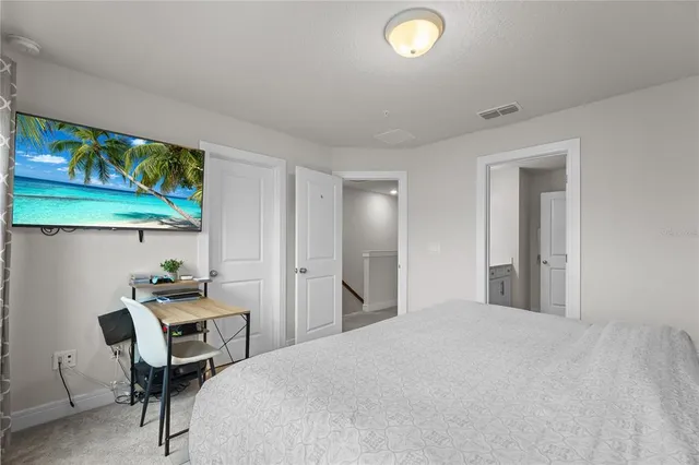 a spacious bathroom with a double vanity sink mirror and shower