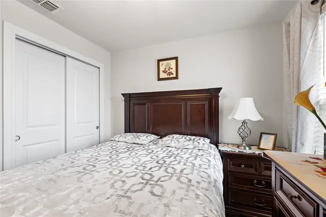 a bedroom with a bed and a dresser