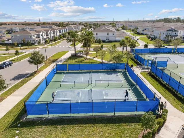 an aerial view of residential houses with outdoor space