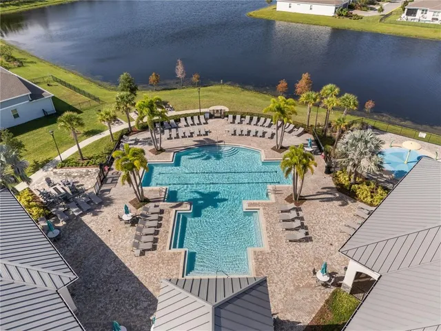 an aerial view of a house with garden space and street view