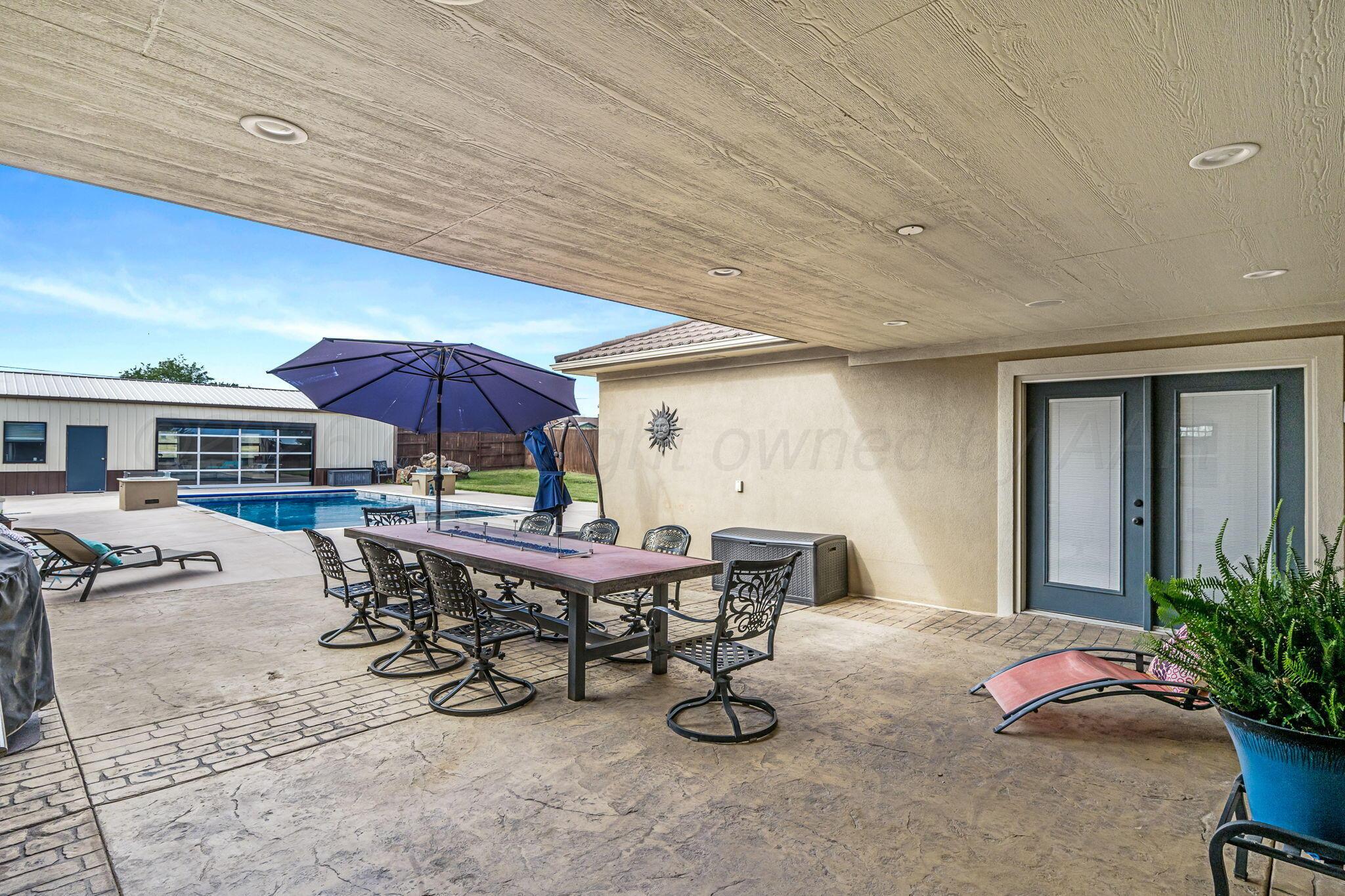 11213 Collin Wade Road Amarillo, TX 79124 - Photo 37 of 48 Covered Patio with Gas Table