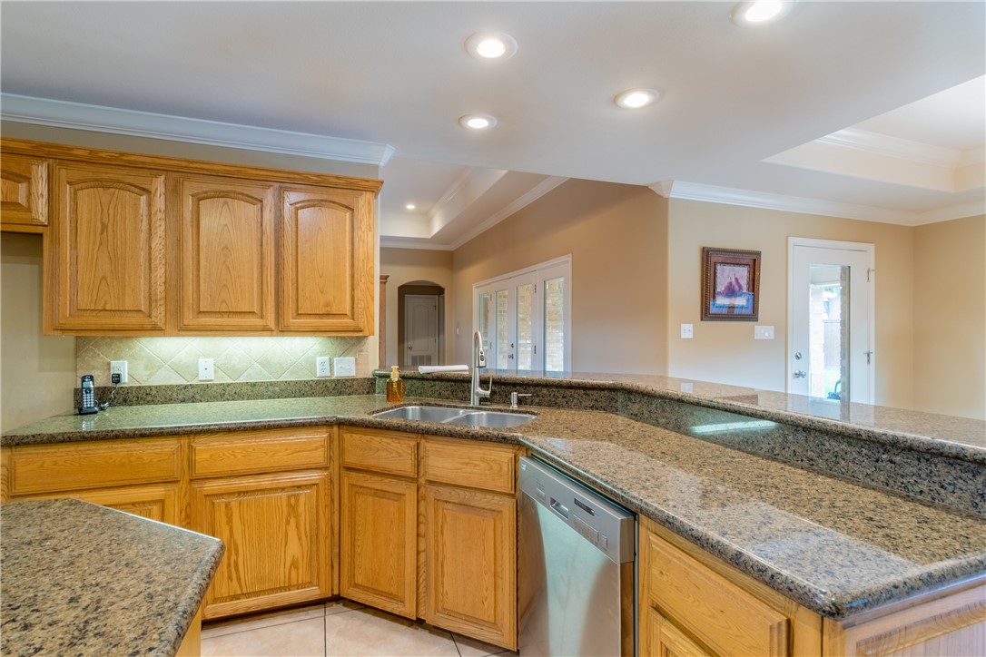 1904 Santa Rosa Drive Alice, TX 78332 - Photo 13 of 34 a kitchen with stainless steel appliances granite countertop a sink and cabinets