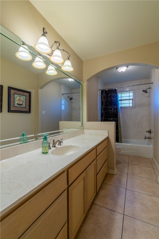 1904 Santa Rosa Drive Alice, TX 78332 - Photo 25 of 34 a bathroom with a sink a large mirror and a shower