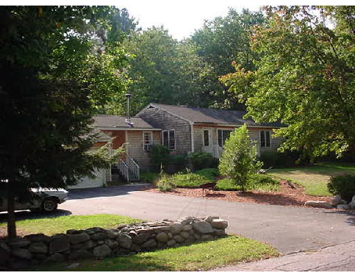100 Harvard Road Littleton, MA 01460 - Photo 1 of 1 a front view of a house with yard and green space