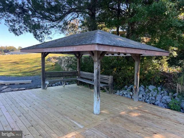 a view of a patio with wooden floor