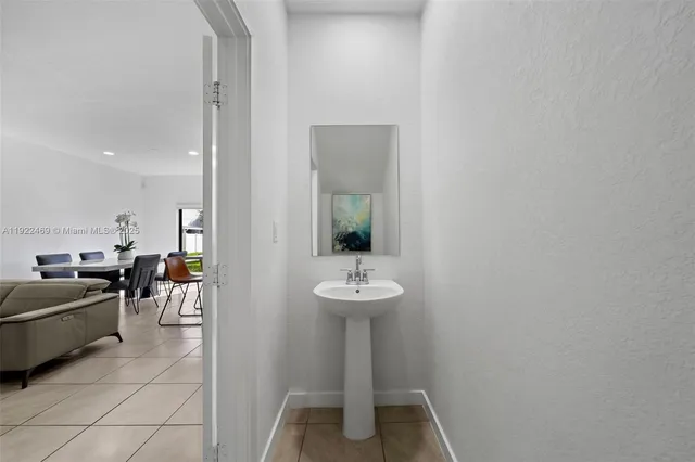 a view of a hallway with living room and furniture