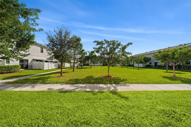 a view of a house with a big yard