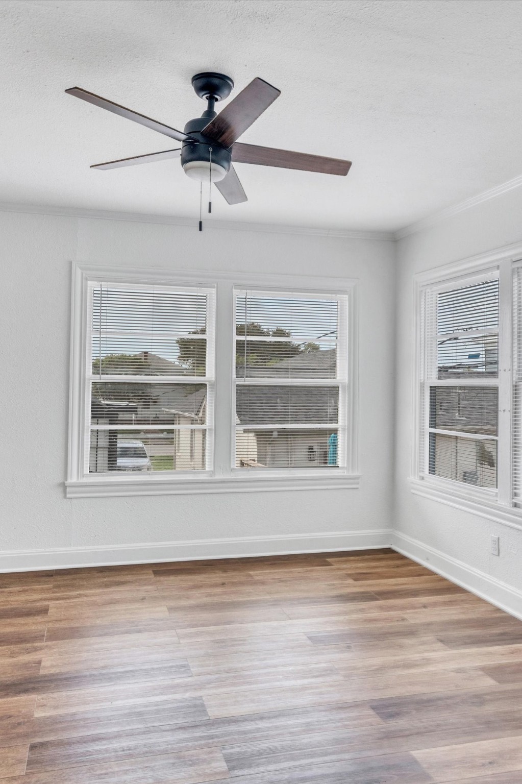 4006 Avenue R 1/2 Rear Galveston, TX 77550 - Photo 12 of 26 a view of an empty room with wooden floor and a window