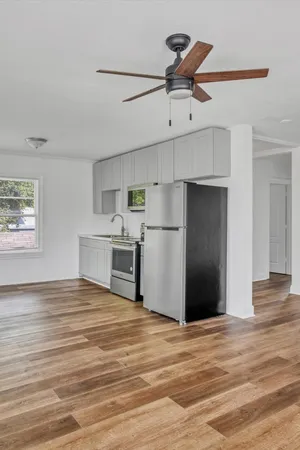 a view of kitchen and wooden floor