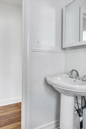 a bathroom with a sink and a mirror