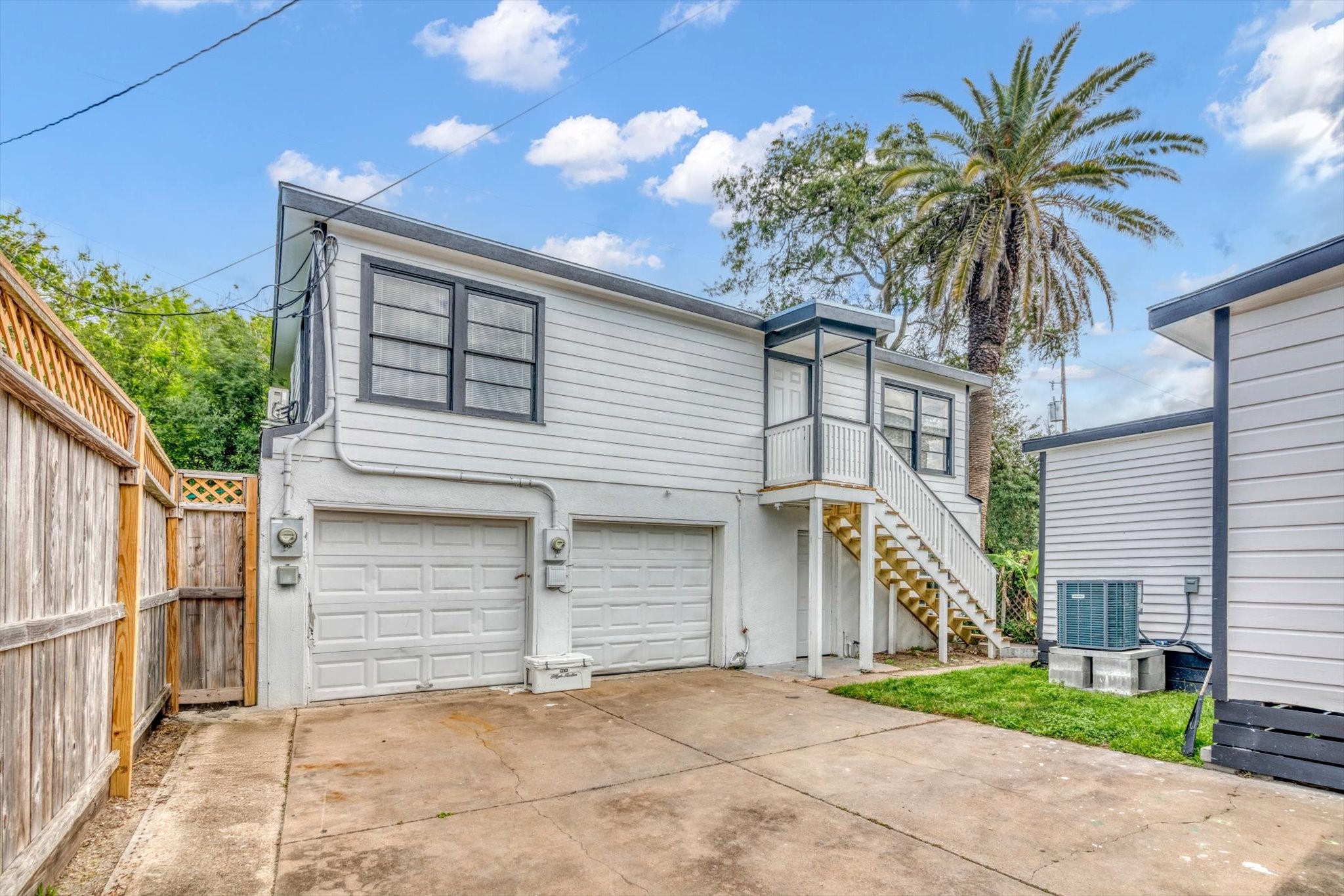 4006 Avenue R 1/2 Rear Galveston, TX 77550 - Photo 2 of 26 a view of a house with a yard and potted plants