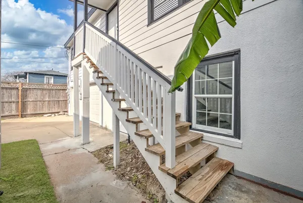 a view of entryway wooden floor and front door