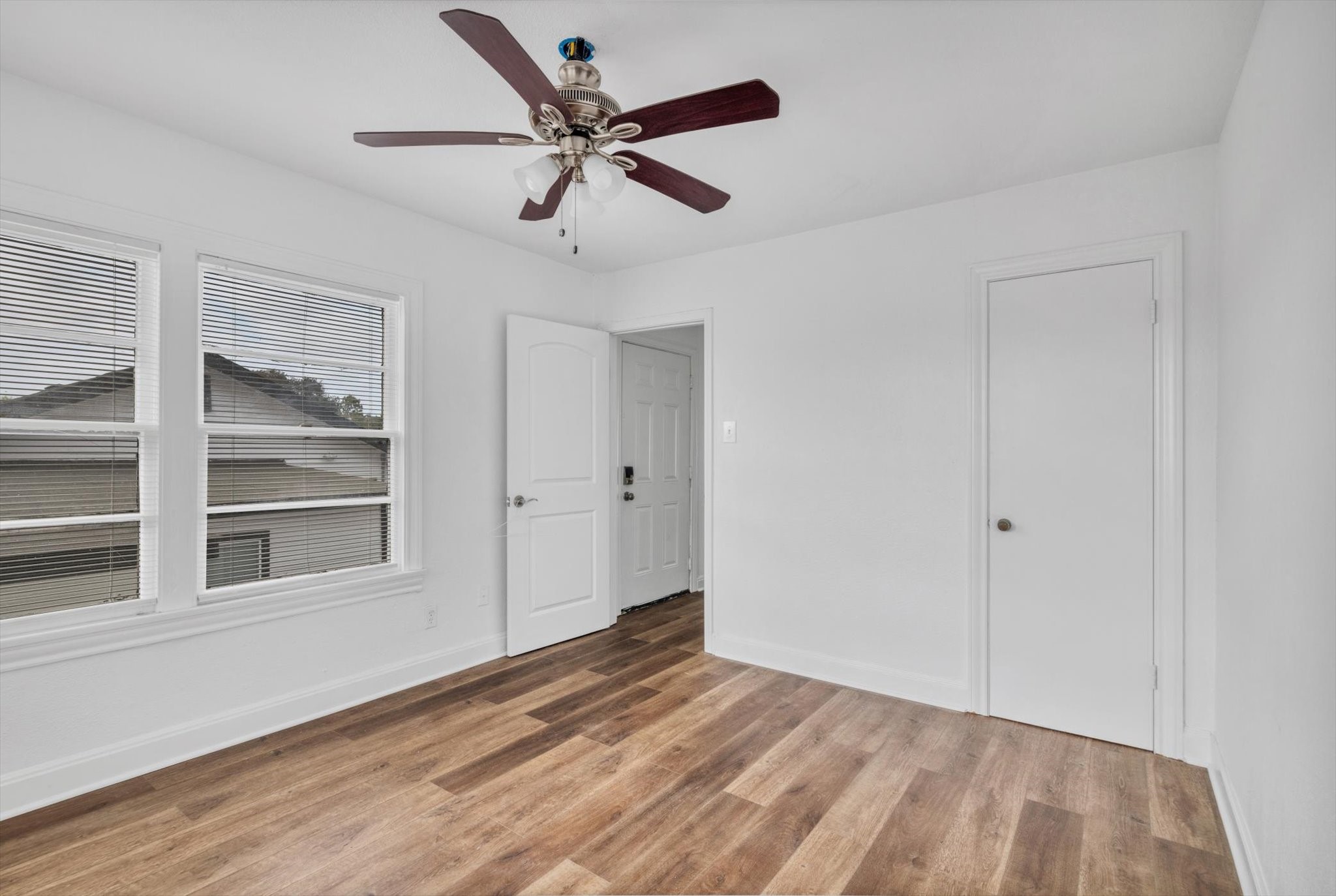 4006 Avenue R 1/2 Rear Galveston, TX 77550 - Photo 6 of 26 a view of empty room with wooden floor and fan