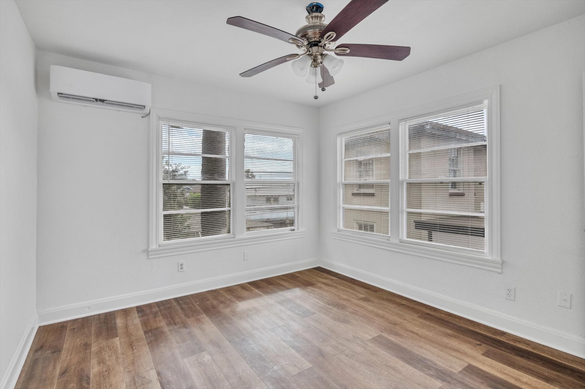 4006 Avenue R 1/2 Rear Galveston, TX 77550 - Photo 7 of 26 a view of an empty room with a window and wooden floor