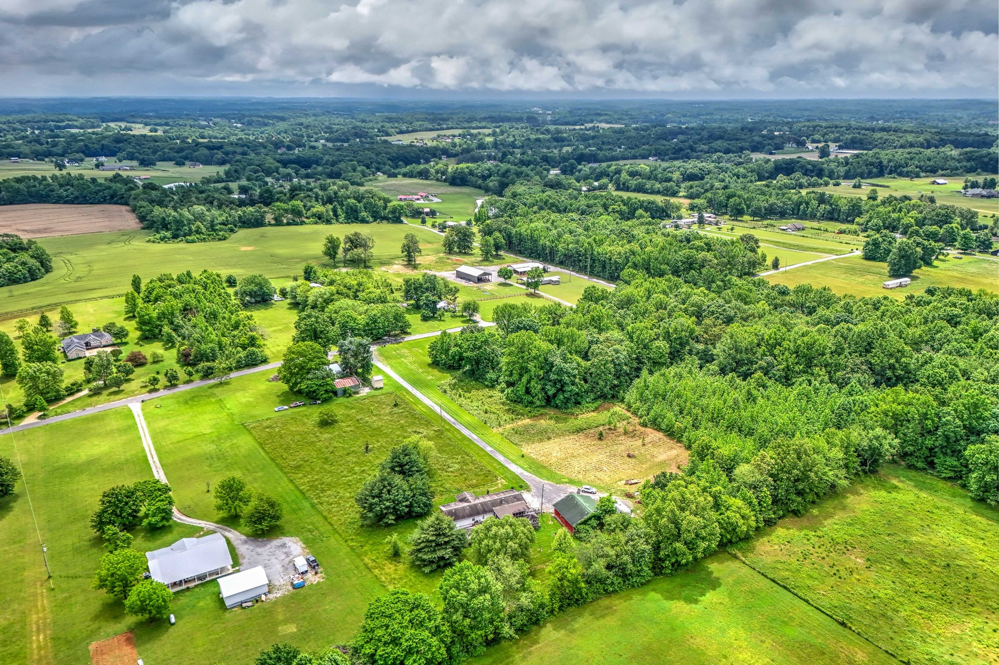 6842 Williams Road Cross Plains, TN 37049 - Photo 11 of 56 an aerial view of residential houses with outdoor space and trees