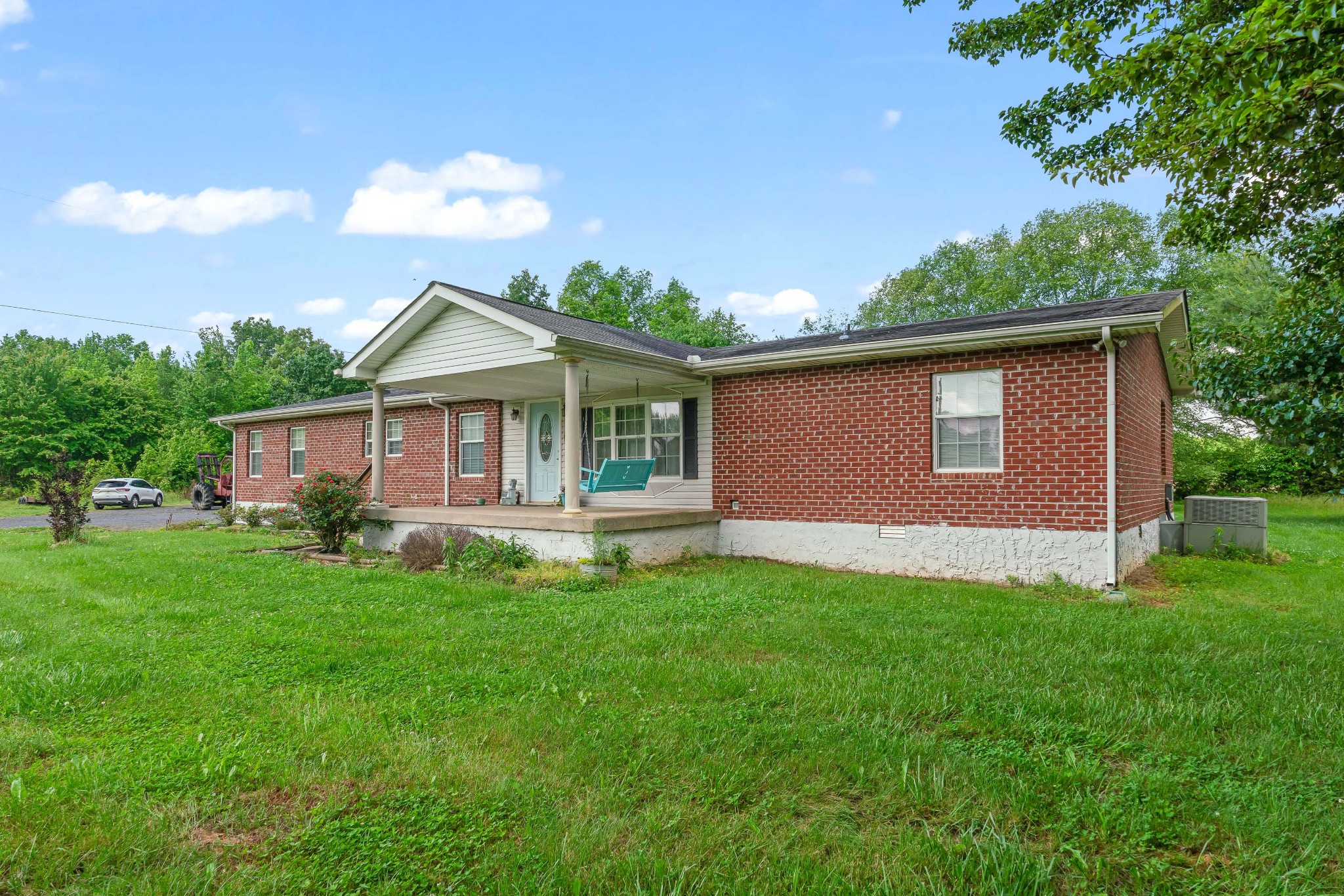 6842 Williams Road Cross Plains, TN 37049 - Photo 12 of 56 a front view of a house with a garden