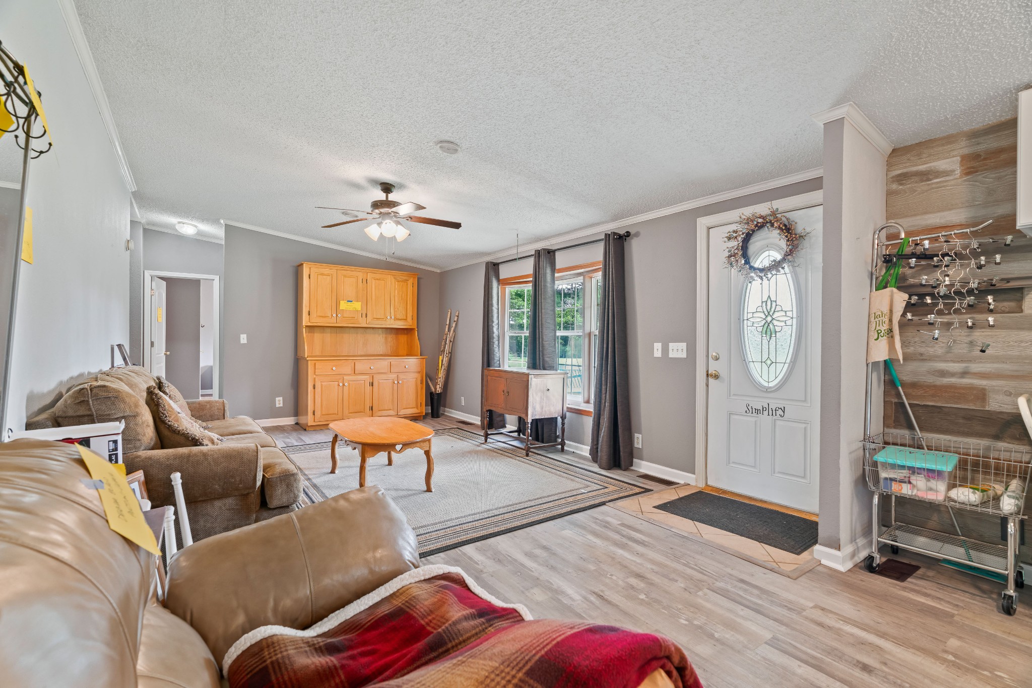 6842 Williams Road Cross Plains, TN 37049 - Photo 17 of 56 a living room with furniture two window and wooden floor