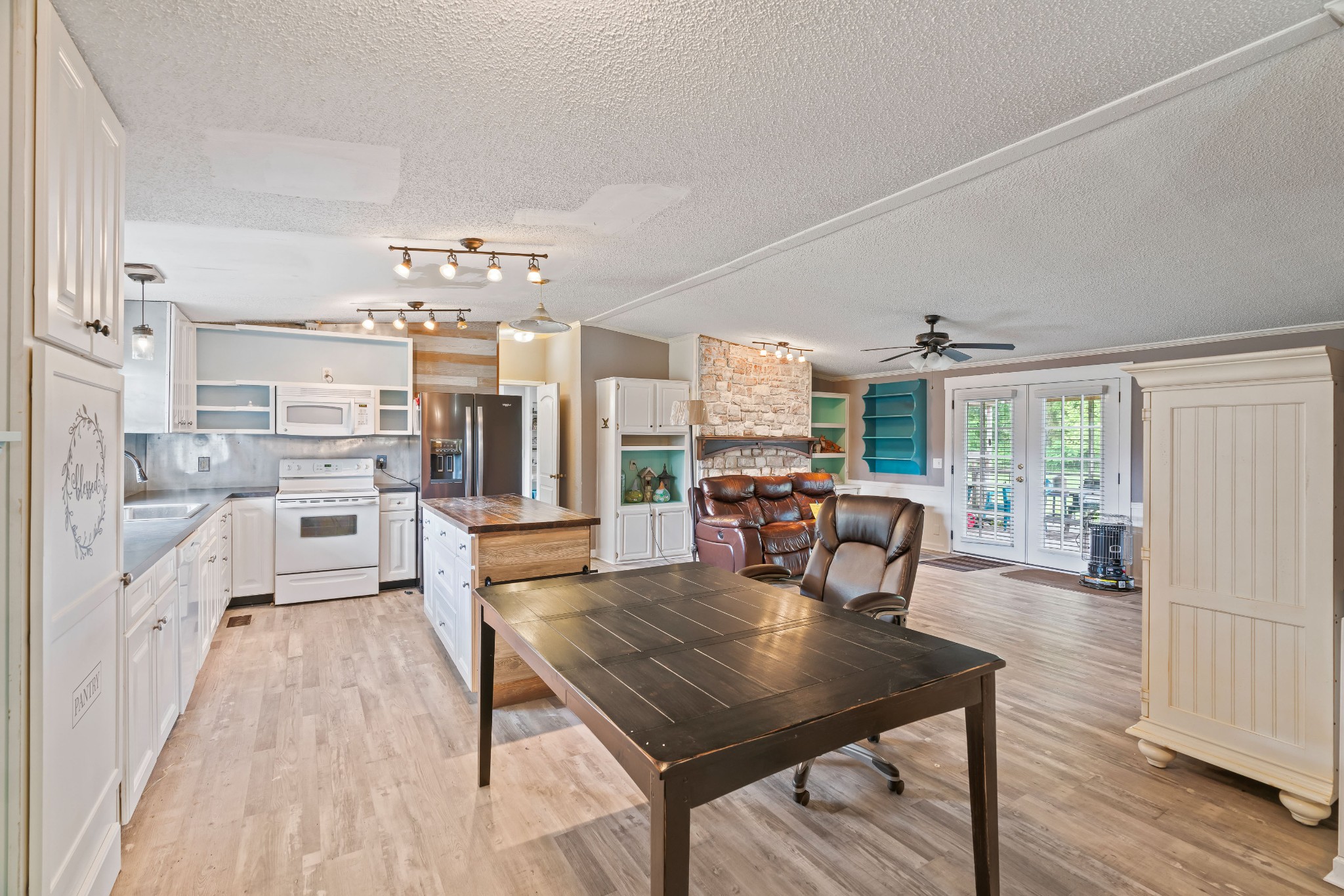 6842 Williams Road Cross Plains, TN 37049 - Photo 20 of 56 a view of a dining room with furniture window and wooden floor