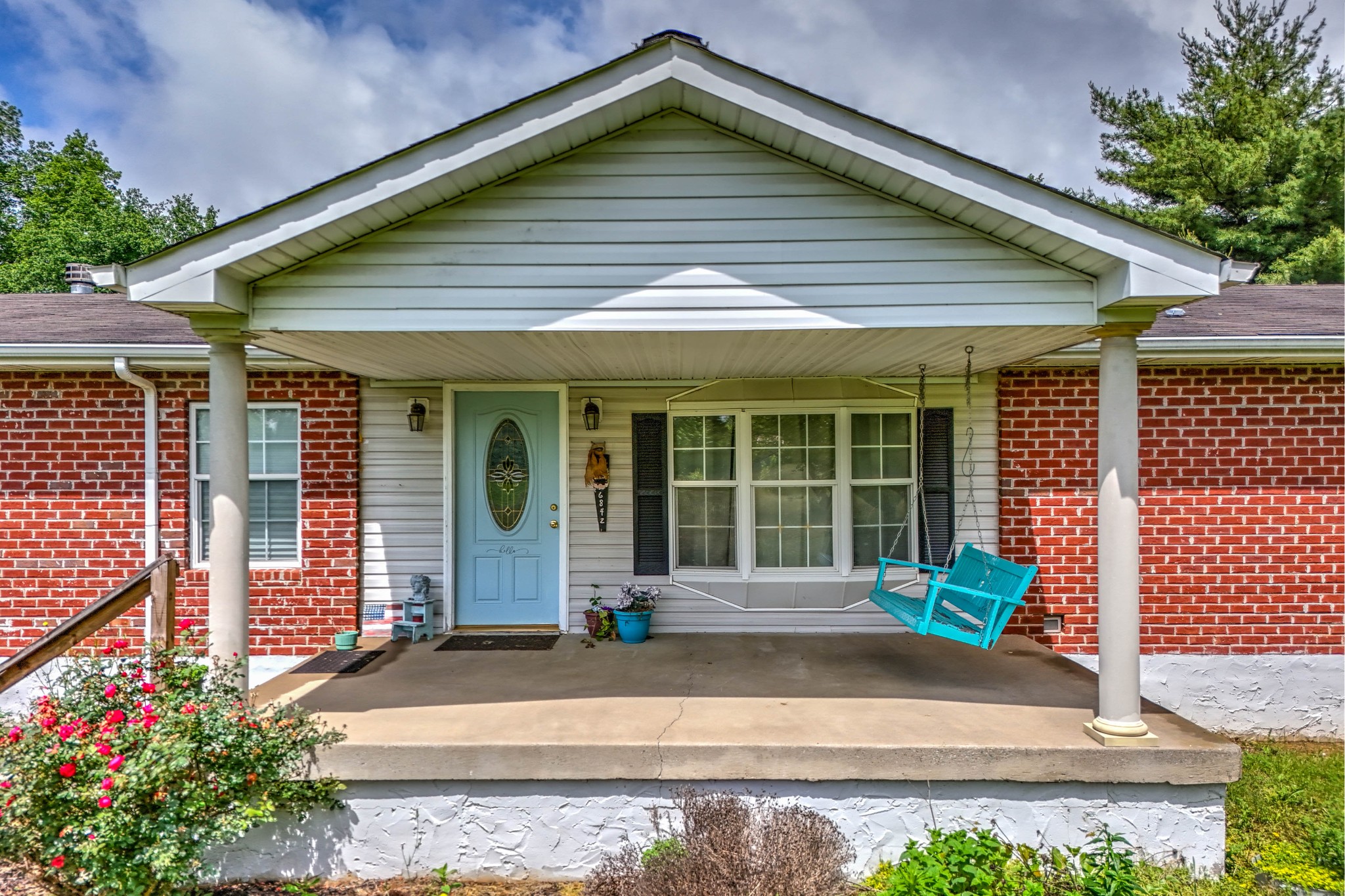 6842 Williams Road Cross Plains, TN 37049 - Photo 2 of 56 a front view of a house with garden