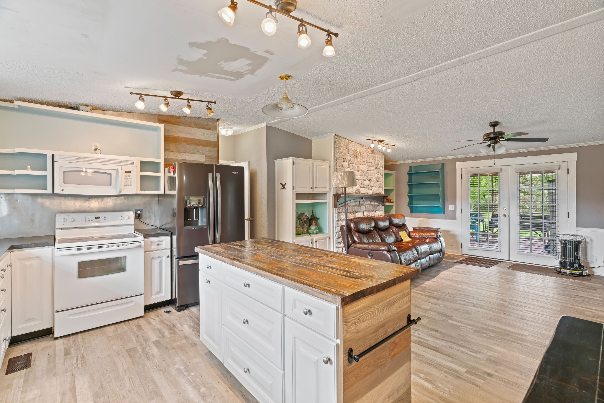 6842 Williams Road Cross Plains, TN 37049 - Photo 26 of 56 a kitchen with stove a refrigerator and furniture