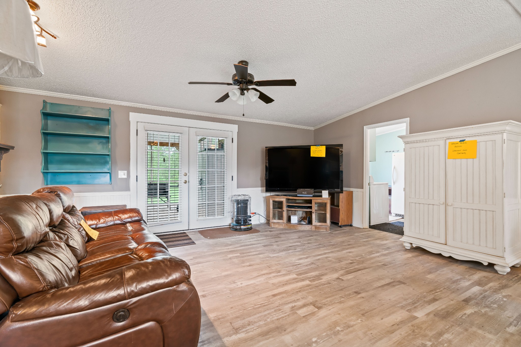 6842 Williams Road Cross Plains, TN 37049 - Photo 27 of 56 a living room with furniture and a flat screen tv