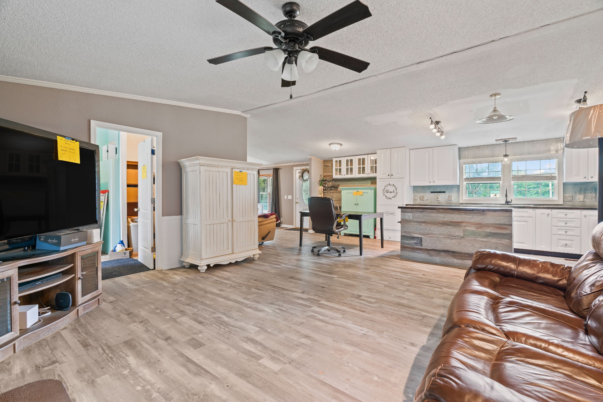 6842 Williams Road Cross Plains, TN 37049 - Photo 29 of 56 a living room with furniture and a flat screen tv