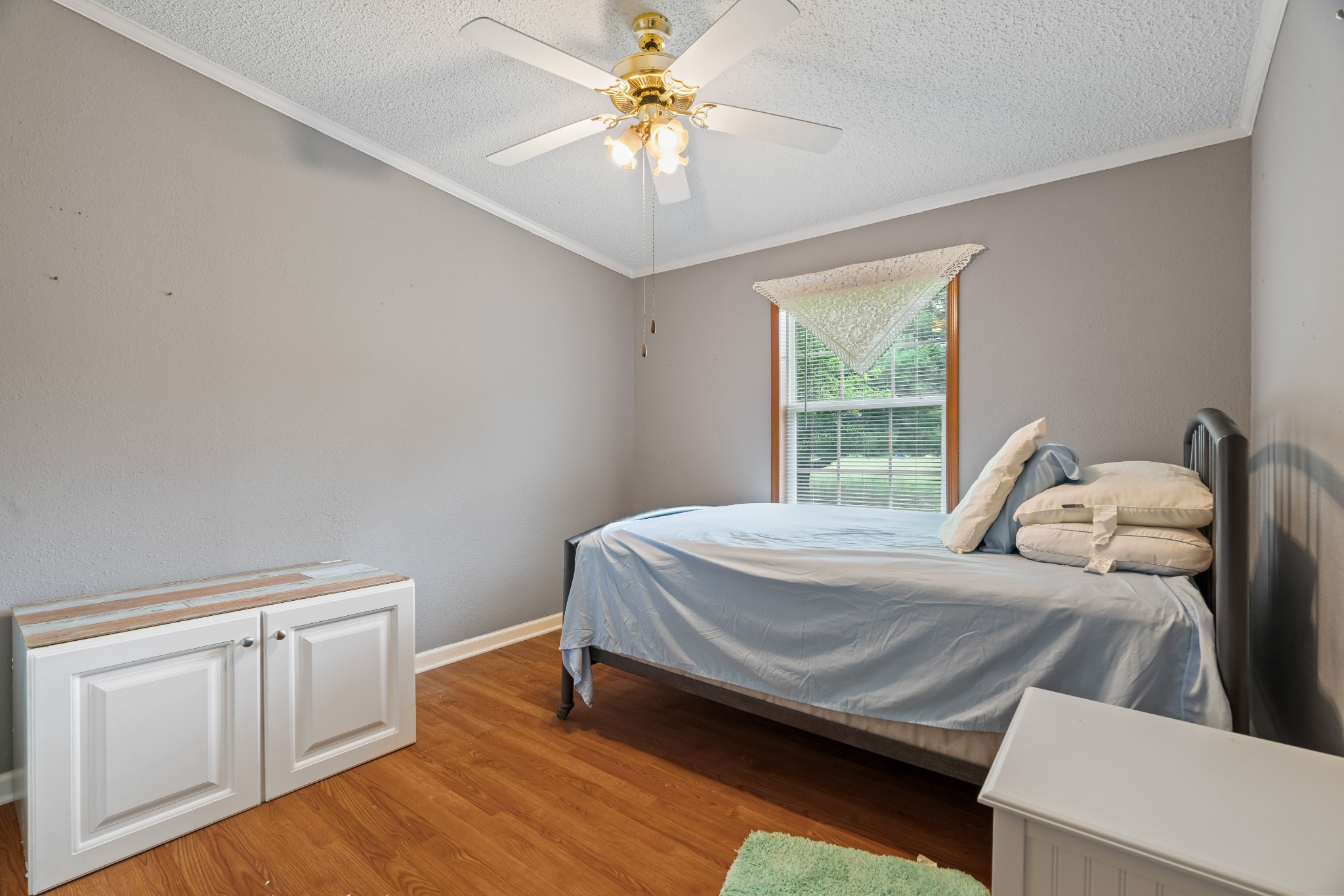 6842 Williams Road Cross Plains, TN 37049 - Photo 41 of 56 a bedroom with a bed and a chandelier