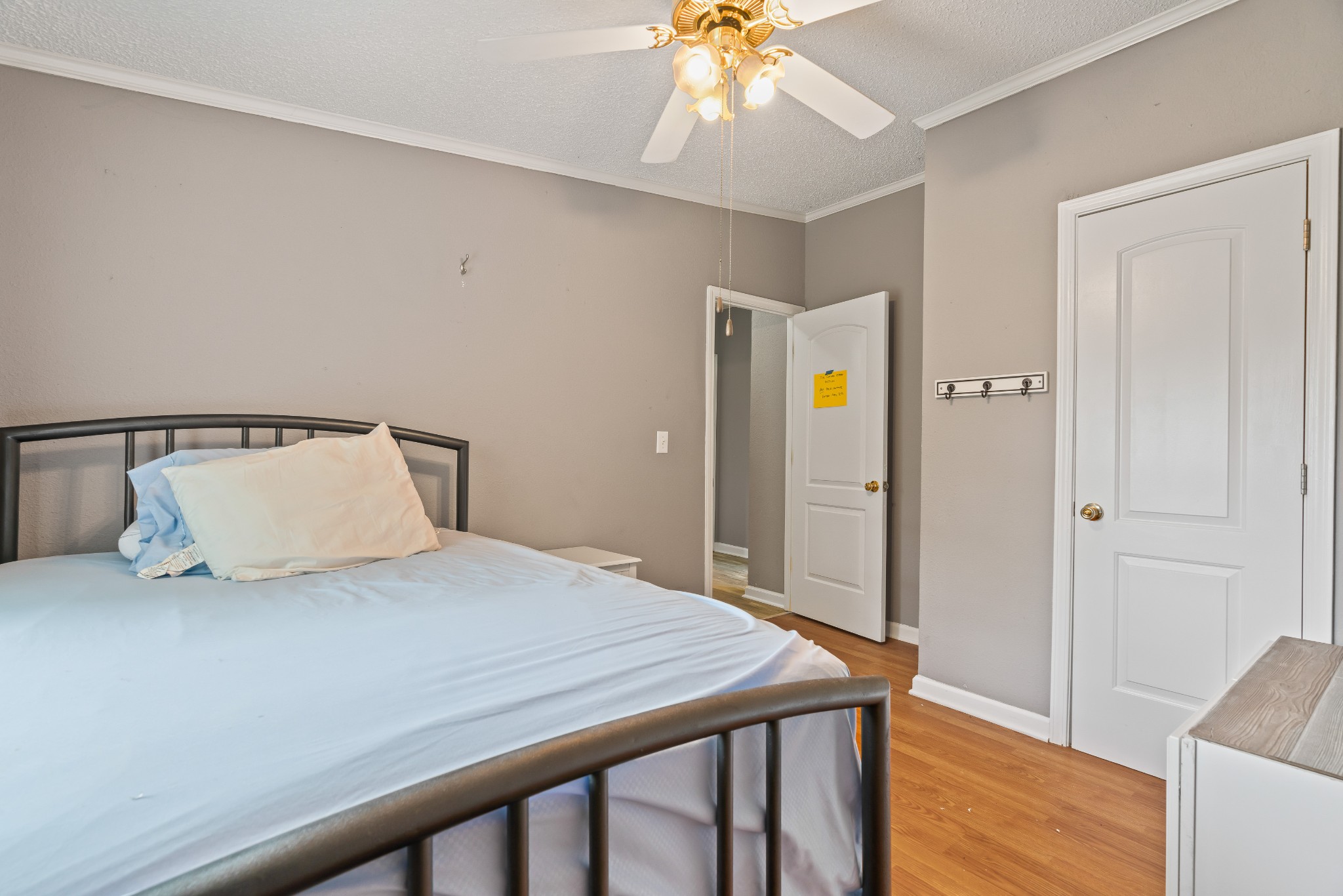 6842 Williams Road Cross Plains, TN 37049 - Photo 42 of 56 a bedroom with a bed and a chandelier