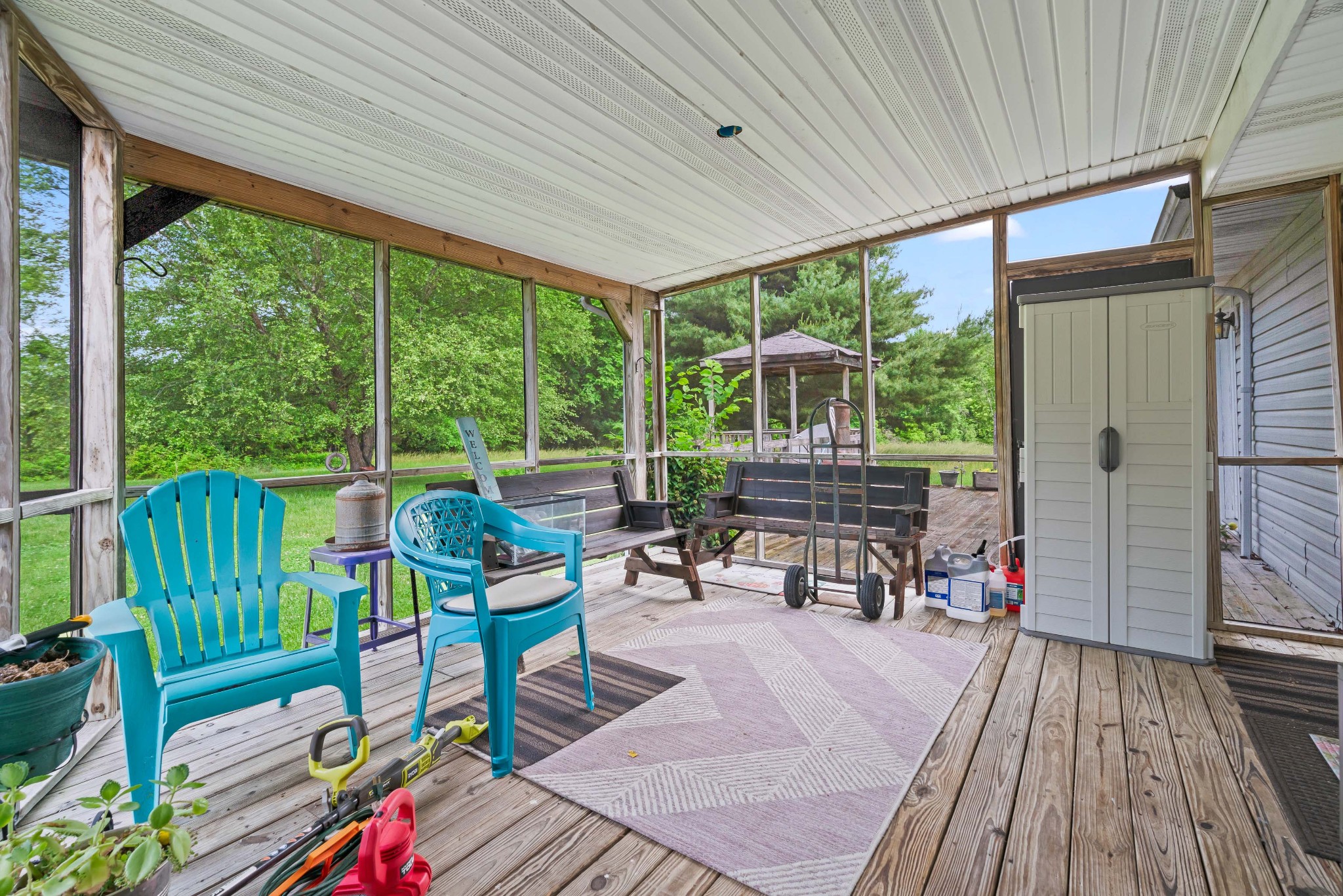 6842 Williams Road Cross Plains, TN 37049 - Photo 49 of 56 a living room with furniture and floor to ceiling windows