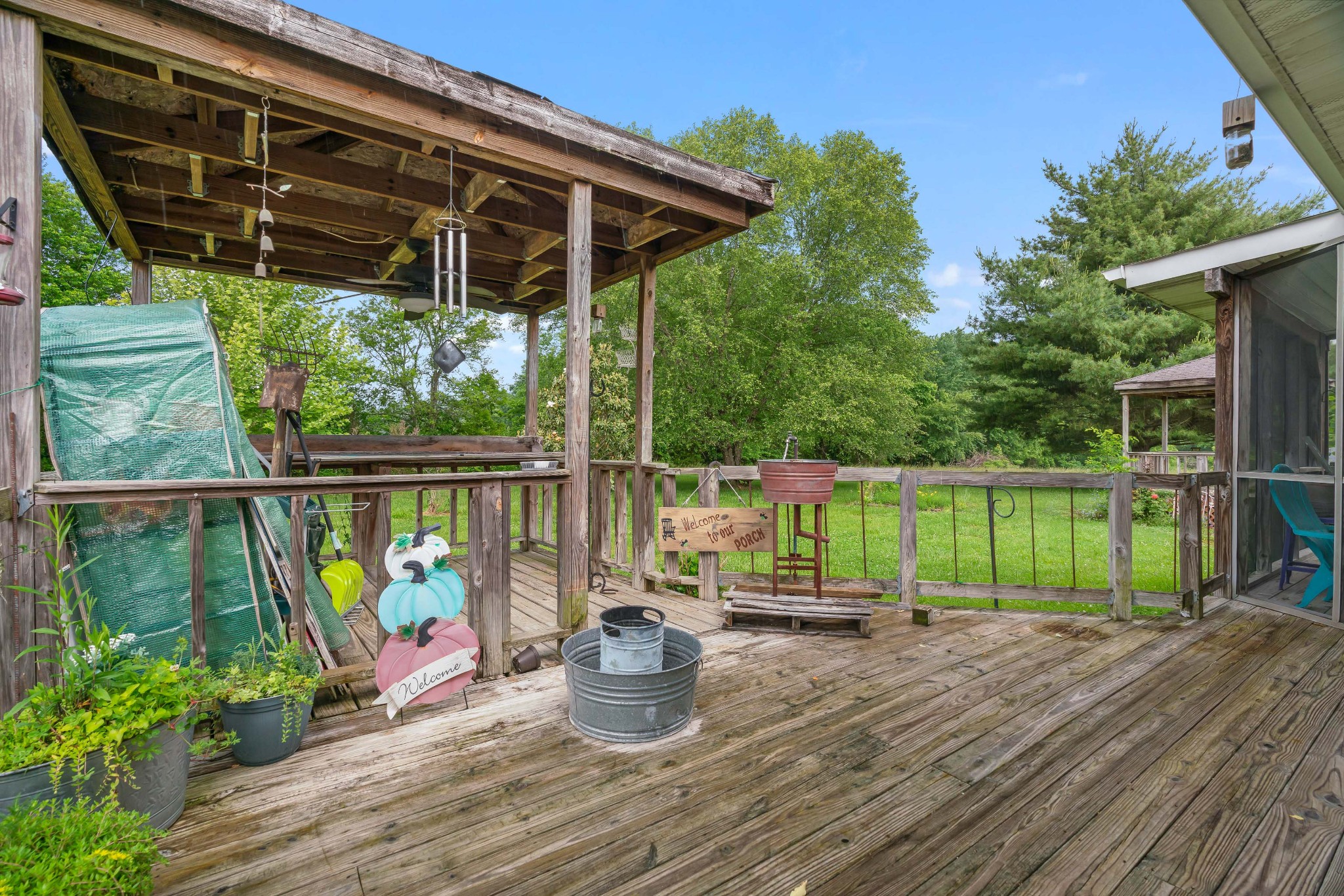 6842 Williams Road Cross Plains, TN 37049 - Photo 51 of 56 a view of a deck with chair and wooden floor