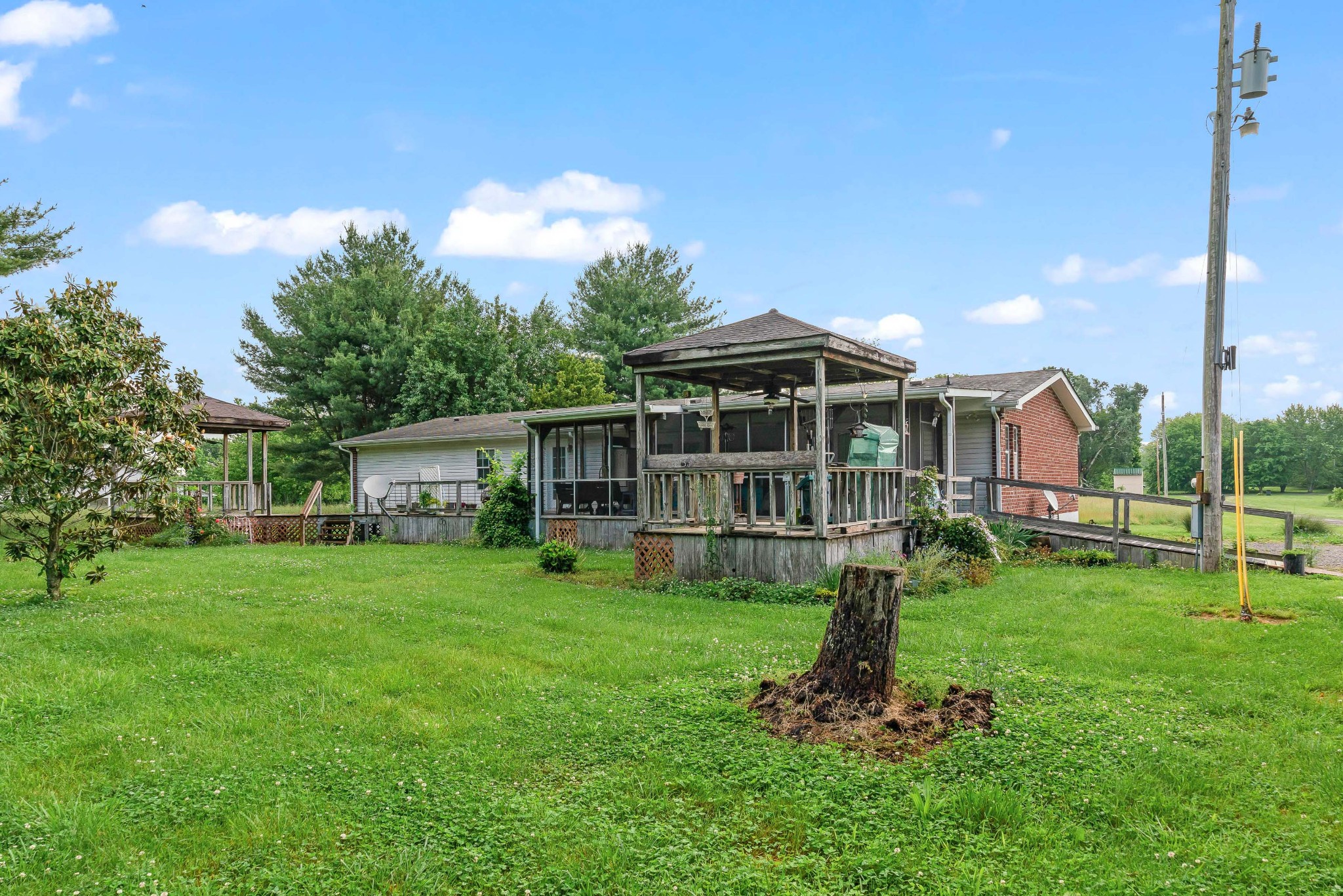 6842 Williams Road Cross Plains, TN 37049 - Photo 53 of 56 a view of a house with a yard porch and sitting area