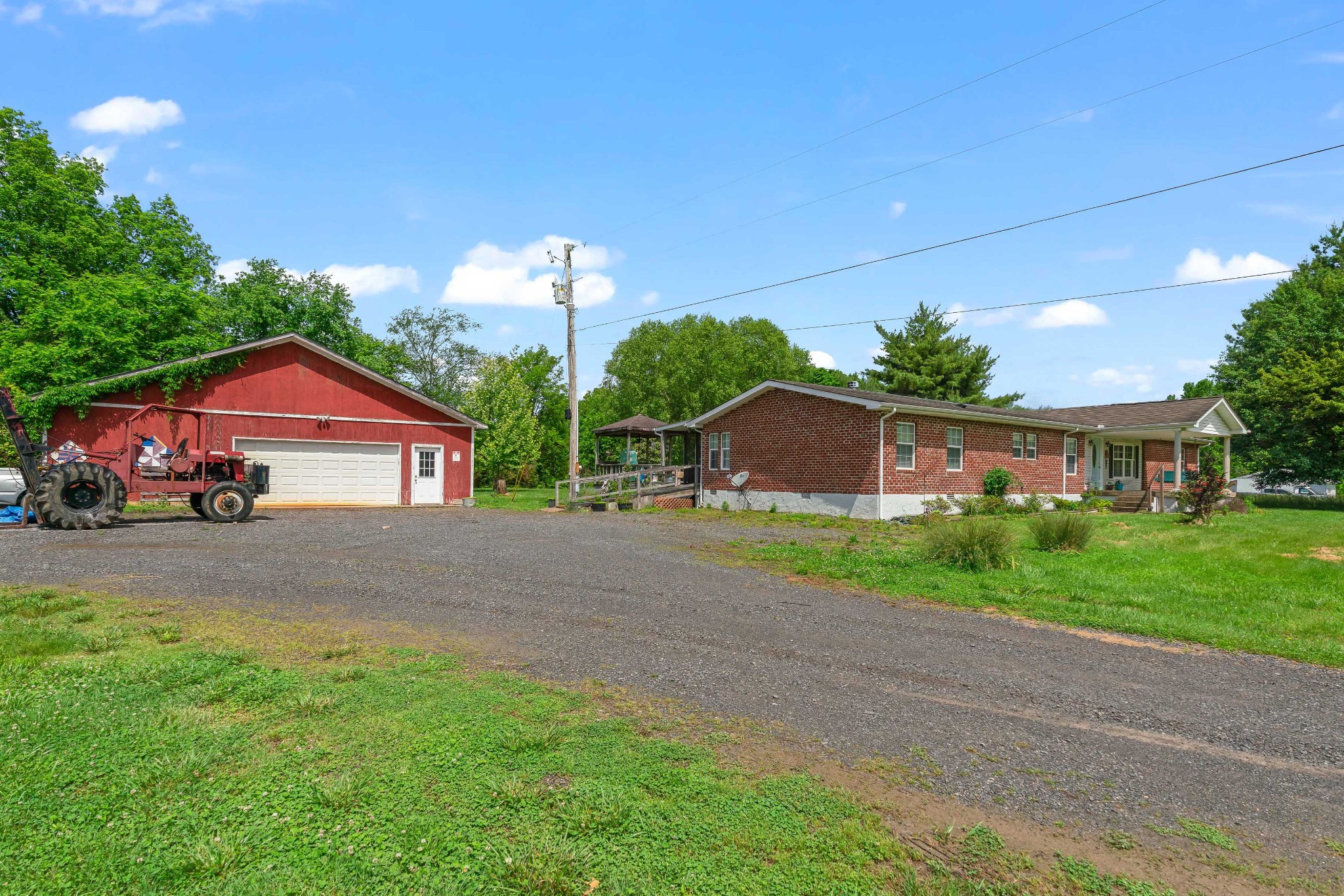 6842 Williams Road Cross Plains, TN 37049 - Photo 56 of 56 a front view of a house with a yard and garage