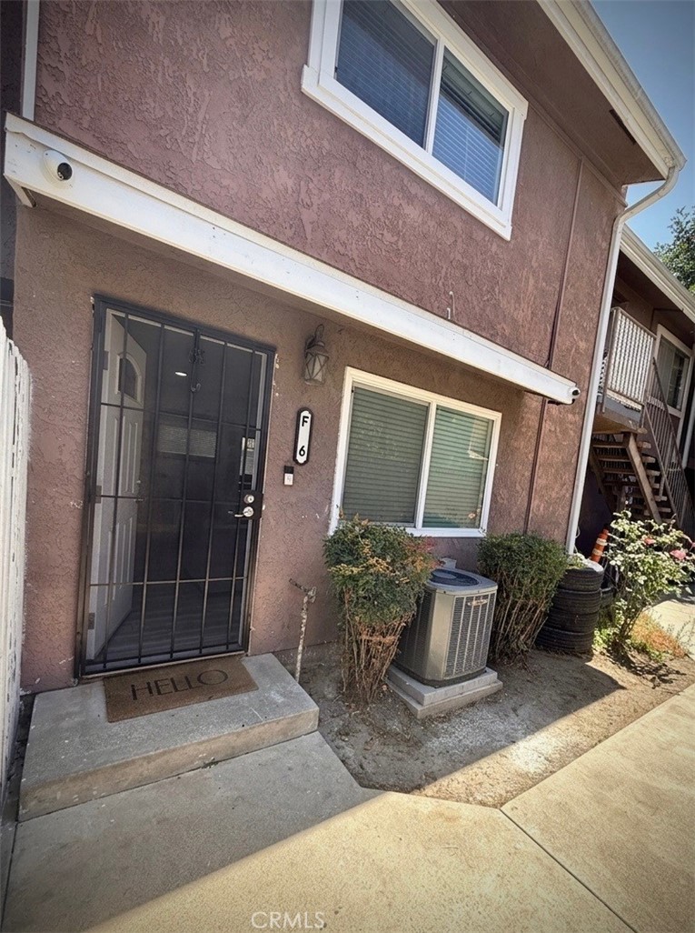 7258 Exeter Street, Unit 6 Paramount, CA 90723 - Photo 15 of 16 a building outdoor space with porch