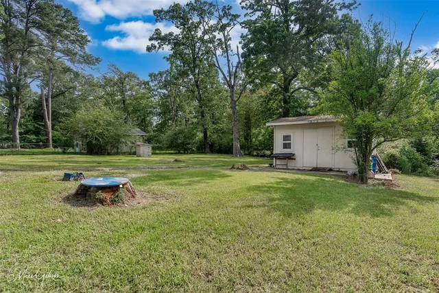a front view of a house with a yard table and chairs