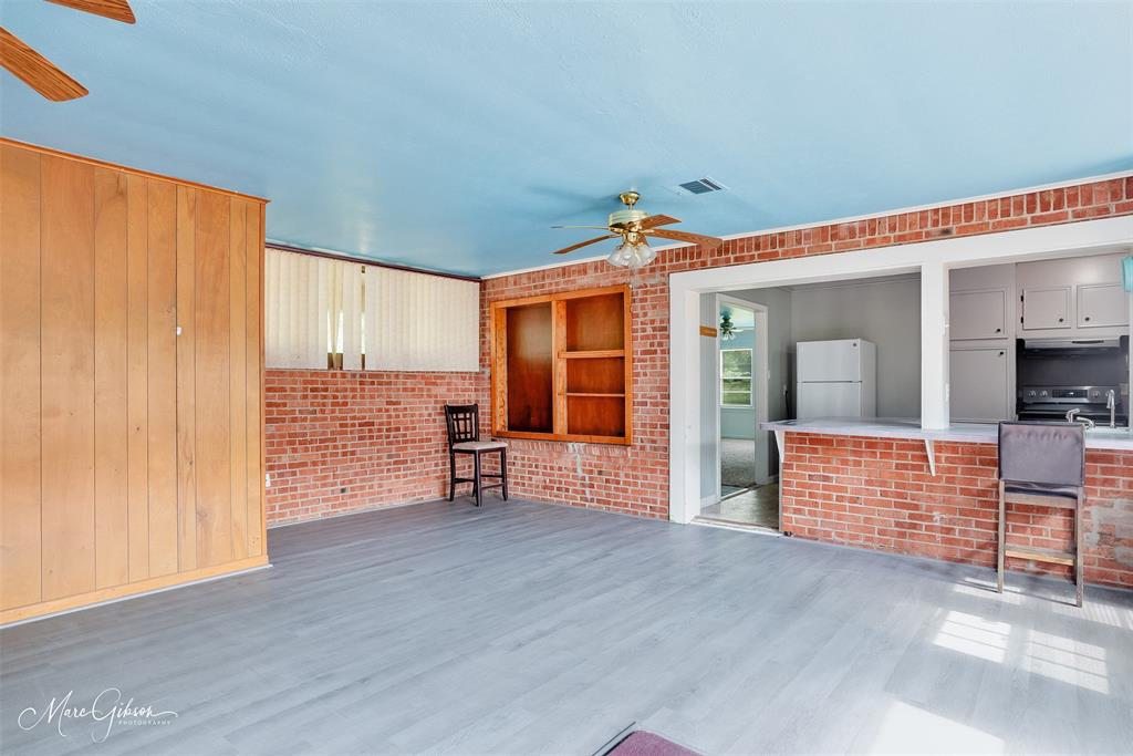 3109 Gorton Road Shreveport, LA 71119 - Photo 7 of 20 an empty room with wooden floor and windows
