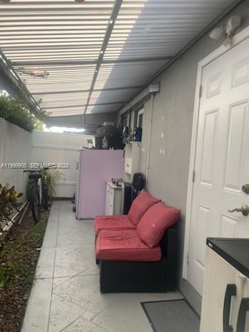1394 West 30th Street Hialeah, FL 33012 - Photo 18 of 21 a view of a room with shelves