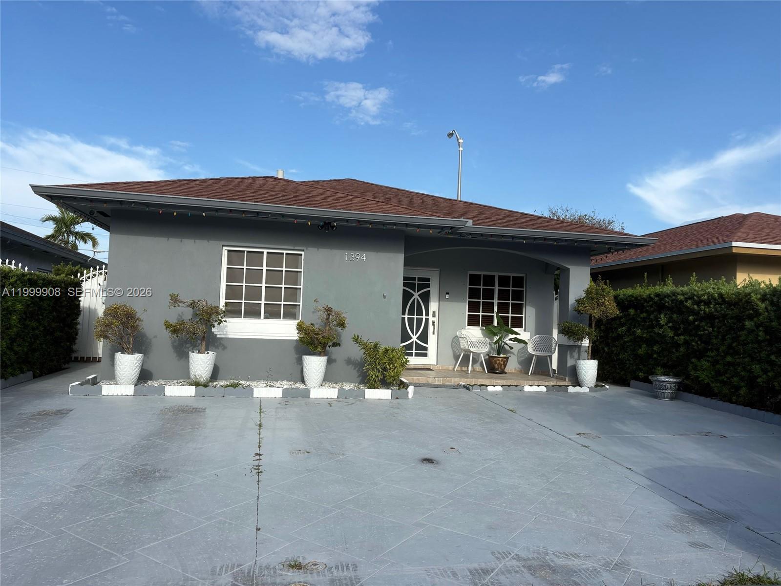 1394 West 30th Street Hialeah, FL 33012 - Photo 3 of 21 a view of a house with patio