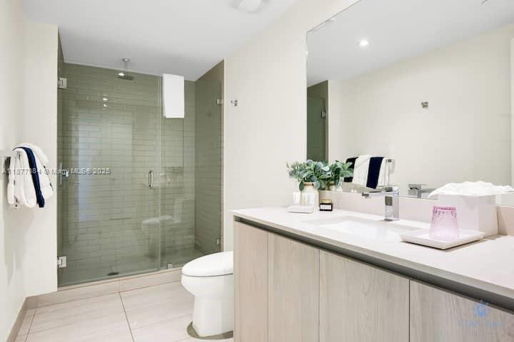 4010 South Ocean Drive, Unit R708 Hollywood, FL 33019 - Photo 17 of 30 a bathroom with a sink toilet and shower