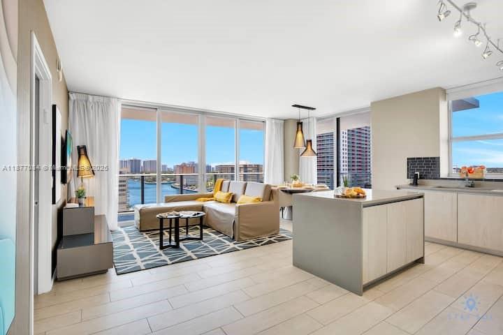 4010 South Ocean Drive, Unit R708 Hollywood, FL 33019 - Photo 19 of 30 a living room with furniture and a large window