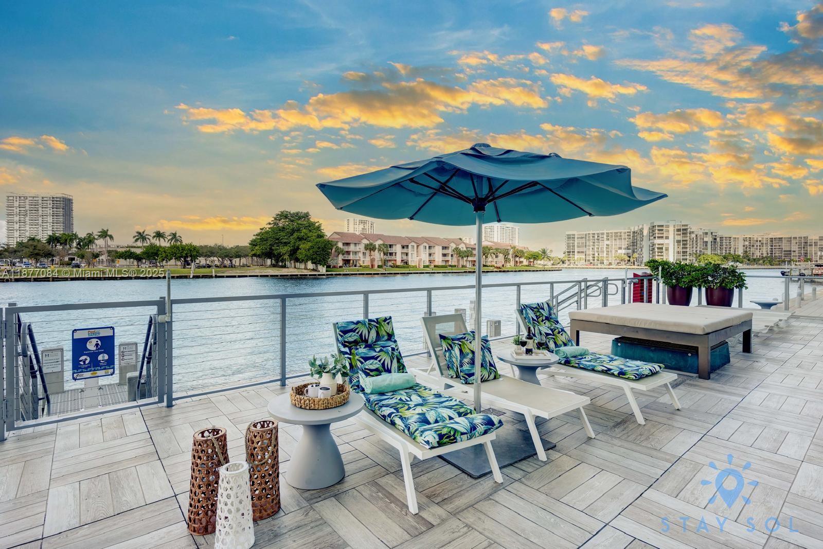 4010 South Ocean Drive, Unit R708 Hollywood, FL 33019 - Photo 24 of 30 a view of a patio with furniture and a umbrella