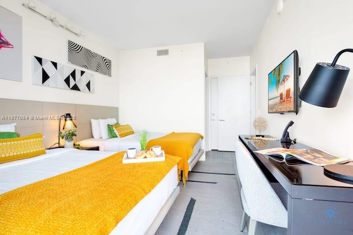 4010 South Ocean Drive, Unit R708 Hollywood, FL 33019 - Photo 4 of 30 a bedroom with a bed and couch