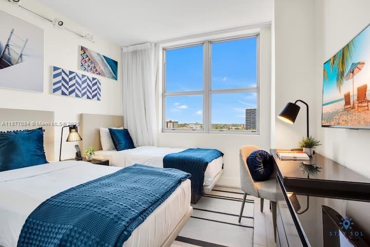 4010 South Ocean Drive, Unit R708 Hollywood, FL 33019 - Photo 5 of 30 a bedroom with furniture and a large window