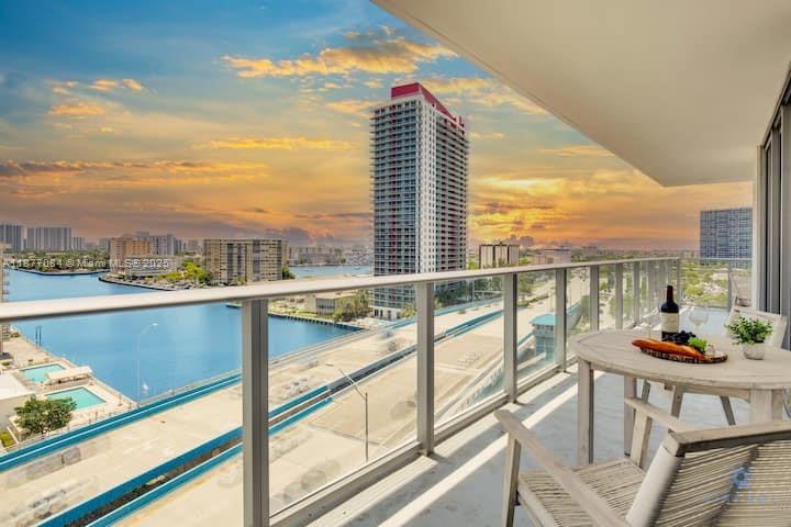 4010 South Ocean Drive, Unit R708 Hollywood, FL 33019 - Photo 8 of 30 a view of a balcony with an outdoor seating