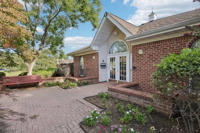 a view of a grassy field with an trees