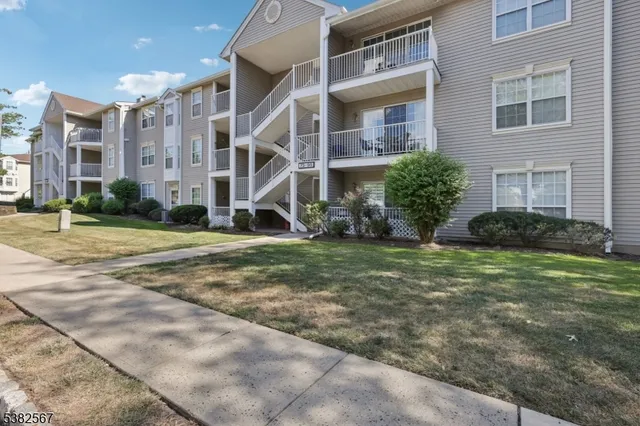 a view of a building with a yard