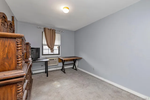 a view of room with window and lounge chair