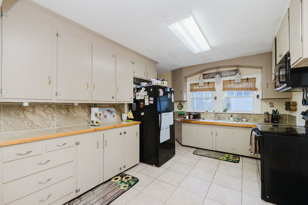75 Randolph Avenue Tiverton, RI 02878 - Photo 11 of 22 a kitchen with a sink and cabinets