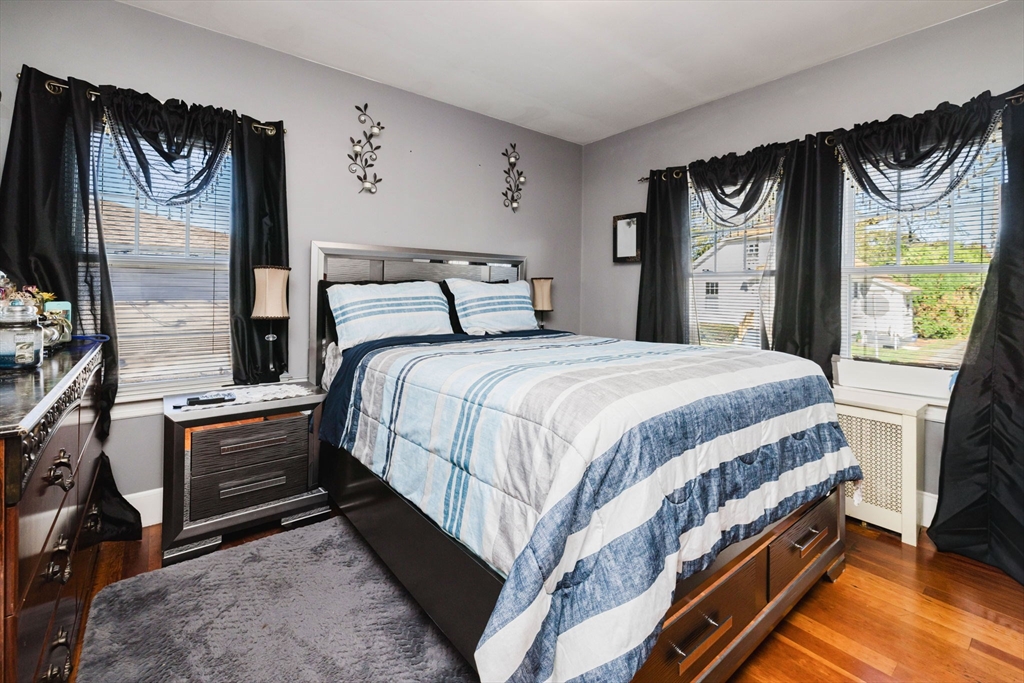 75 Randolph Avenue Tiverton, RI 02878 - Photo 13 of 22 a bedroom with a bed next to a window with outer view